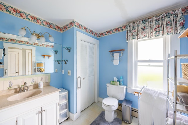 33 Neally St, South Berwick, ME 03908 - bathroom with a closet, vanity, toilet, tile patterned floors, and a baseboard radiator