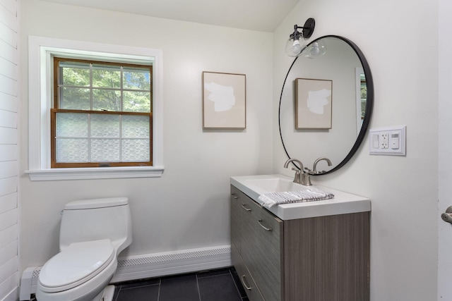 39 Solomon Dr, Gorham, ME 04038 - bathroom with vanity, baseboard heating, toilet, tile patterned floors, and baseboards