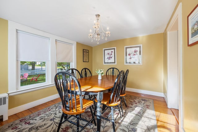 75 Ledgelawn Ave, Bar Harbor, ME 04609 - dining space featuring a chandelier and wood finished floors