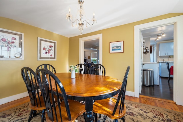 75 Ledgelawn Ave, Bar Harbor, ME 04609 - dining space featuring a chandelier and wood finished floors