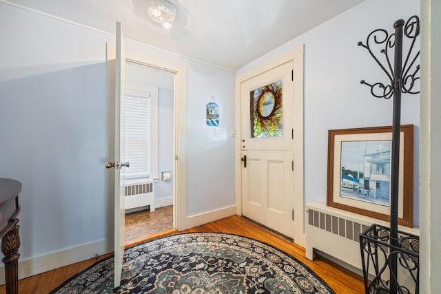 75 Ledgelawn Ave, Bar Harbor, ME 04609 - entrance foyer featuring radiator heating unit and light wood finished floors