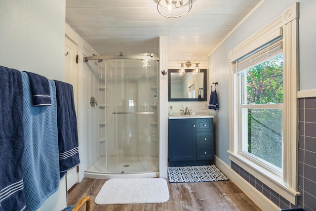 75 Ledgelawn Ave, Bar Harbor, ME 04609 - bathroom with wood finished floors, a stall shower, and vanity