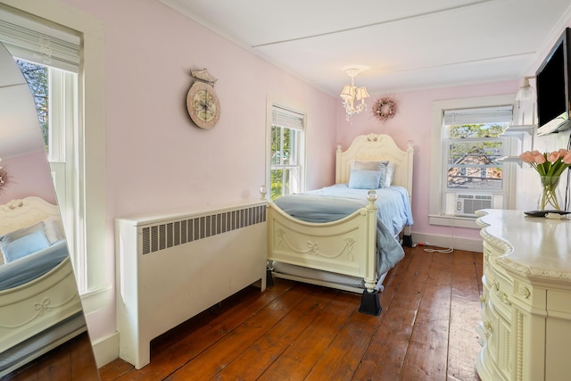 75 Ledgelawn Ave, Bar Harbor, ME 04609 - bedroom with radiator heating unit, a chandelier, dark wood finished floors, and cooling unit