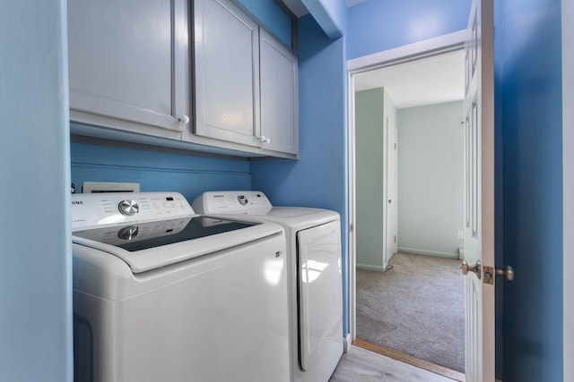 165 Temple Ave Unit 1, Old Orchard Beach, ME 04064 - laundry room with independent washer and dryer, light carpet, cabinet space, and baseboards