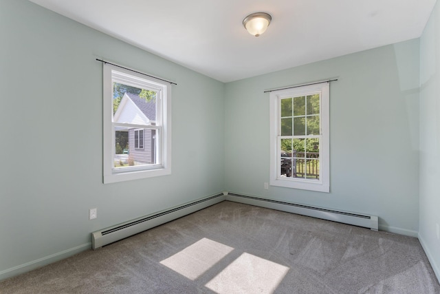 165 Temple Ave Unit 1, Old Orchard Beach, ME 04064 - carpeted empty room with plenty of natural light, a baseboard radiator, and baseboards