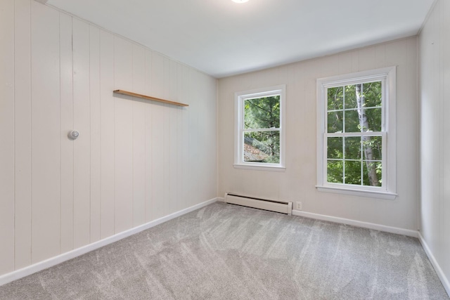 165 Temple Ave Unit 1, Old Orchard Beach, ME 04064 - carpeted empty room with a baseboard radiator and baseboards