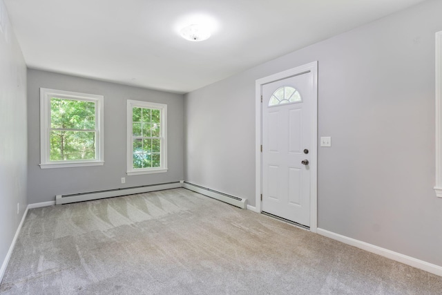 165 Temple Ave Unit 1, Old Orchard Beach, ME 04064 - carpeted entryway featuring plenty of natural light, a baseboard radiator, and baseboards