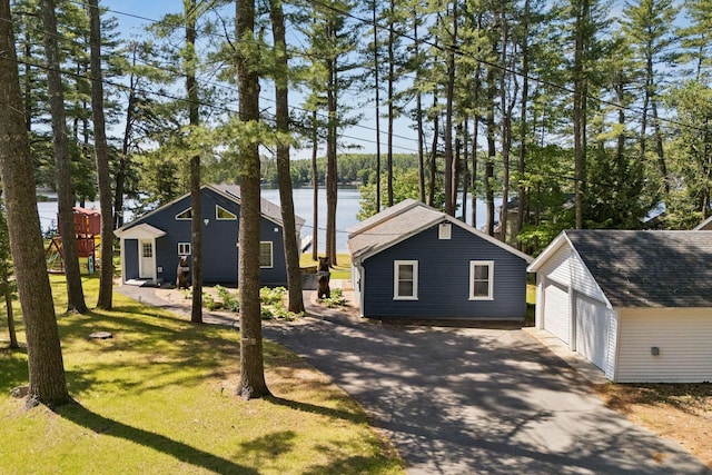 31 Middle Rd, Acton, ME 04001 - view of front of house featuring an outbuilding, a detached garage, and a front lawn