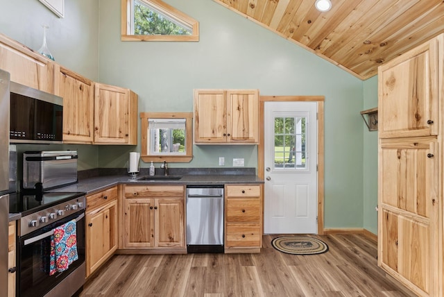 31 Middle Rd, Acton, ME 04001 - kitchen featuring appliances with stainless steel finishes, a sink, dark countertops, light brown cabinets, and wood ceiling