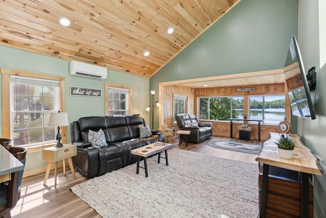 31 Middle Rd, Acton, ME 04001 - living room with a wall unit AC, wood finished floors, high vaulted ceiling, recessed lighting, and wooden ceiling