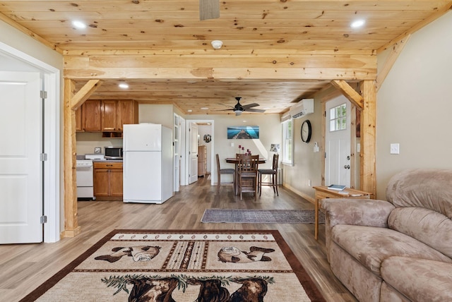 31 Middle Rd, Acton, ME 04001 - living area with an AC wall unit, wood finished floors, wood ceiling, ceiling fan, and recessed lighting