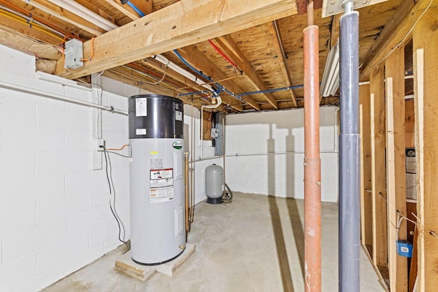 16 Van Buren Dr, Newfield, ME 04095 - unfinished below grade area featuring water heater, a water pressure tank, and concrete block wall