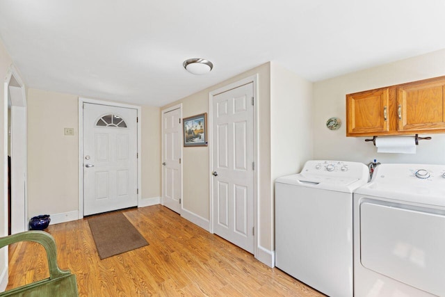 16 Van Buren Dr, Newfield, ME 04095 - laundry room featuring cabinet space, washer and dryer, light wood-style flooring, and baseboards