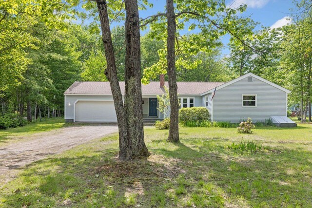 16 Van Buren Dr, Newfield, ME 04095 - view of front of property featuring driveway, an attached garage, a front lawn, and a chimney