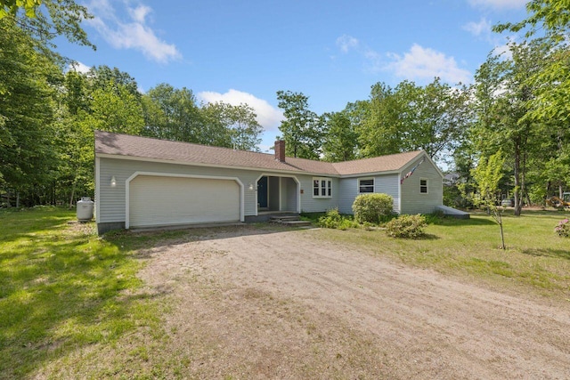 16 Van Buren Dr, Newfield, ME 04095 - ranch-style house with driveway, an attached garage, a chimney, and a front yard