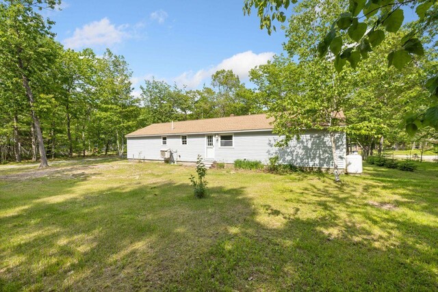 16 Van Buren Dr, Newfield, ME 04095 - rear view of property featuring a lawn