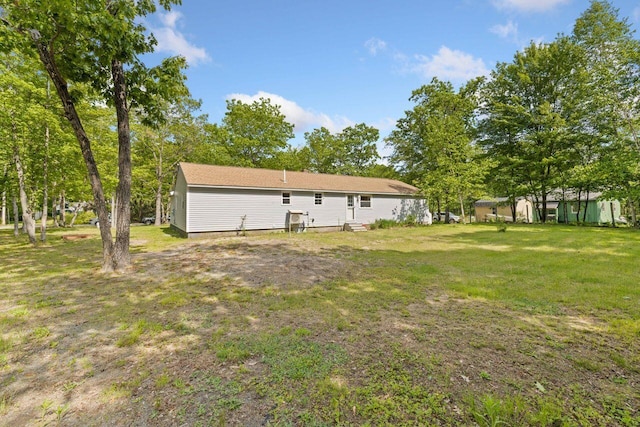 16 Van Buren Dr, Newfield, ME 04095 - back of property with a lawn
