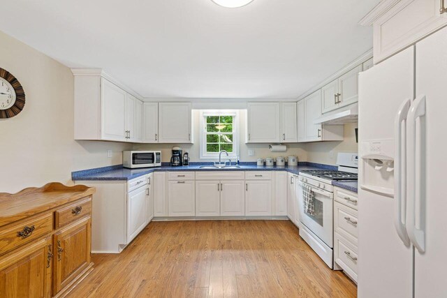 16 Van Buren Dr, Newfield, ME 04095 - kitchen with white appliances, a sink, under cabinet range hood, and dark countertops