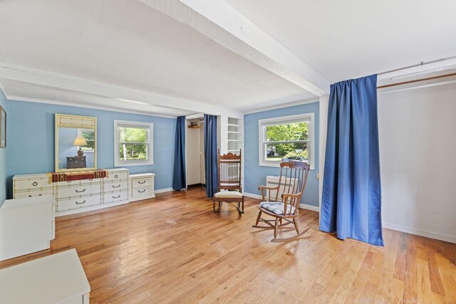 16 Van Buren Dr, Newfield, ME 04095 - sitting room with plenty of natural light, wood finished floors, and baseboards