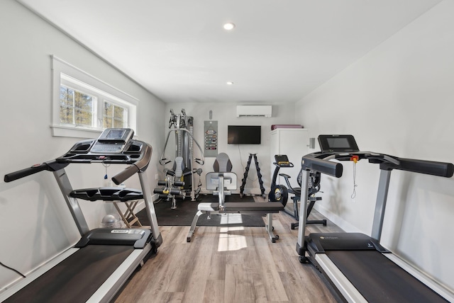 12 Haleys Ct Unit 21, Wells, ME 04090 - exercise room featuring an AC wall unit, light wood-style flooring, recessed lighting, and baseboards