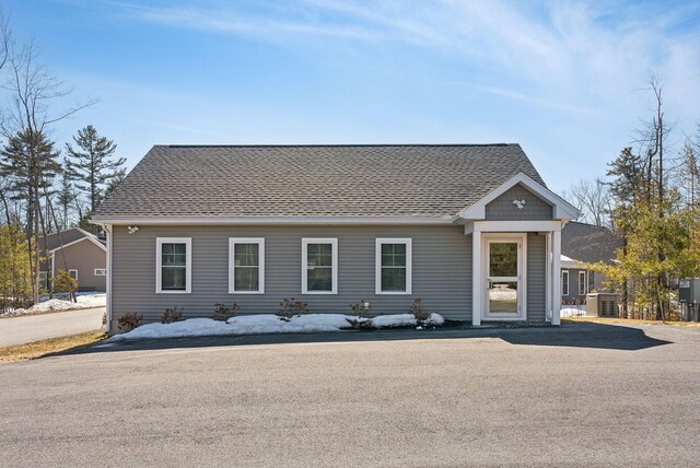 12 Haleys Ct Unit 21, Wells, ME 04090 - view of front of home with central air condition unit and roof with shingles