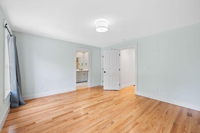 12 Haleys Ct Unit 21, Wells, ME 04090 - unfurnished room with light wood-style floors and baseboards