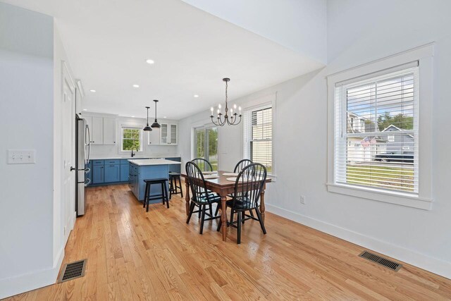 12 Haleys Ct Unit 21, Wells, ME 04090 - dining room with a chandelier, light wood finished floors, baseboards, and recessed lighting