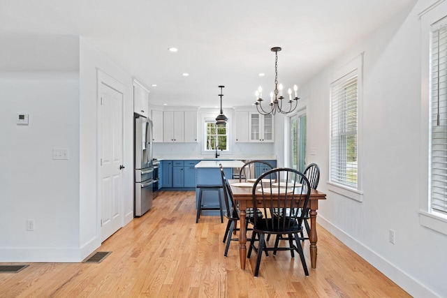 12 Haleys Ct Unit 21, Wells, ME 04090 - dining space with a chandelier, light wood-type flooring, baseboards, and recessed lighting