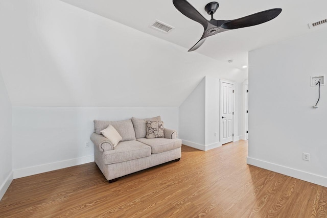 12 Haleys Ct Unit 21, Wells, ME 04090 - living area with ceiling fan, light wood finished floors, vaulted ceiling, and baseboards