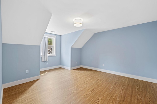 12 Haleys Ct Unit 21, Wells, ME 04090 - additional living space featuring wood finished floors, vaulted ceiling, and baseboards