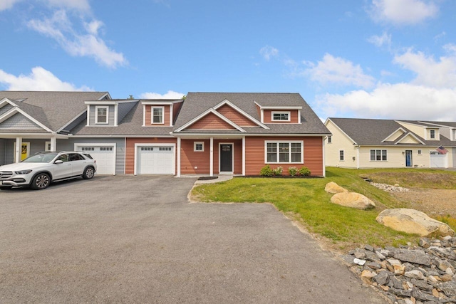12 Haleys Ct Unit 21, Wells, ME 04090 - townhome / multi-family property featuring asphalt driveway, a front yard, an attached garage, and roof with shingles