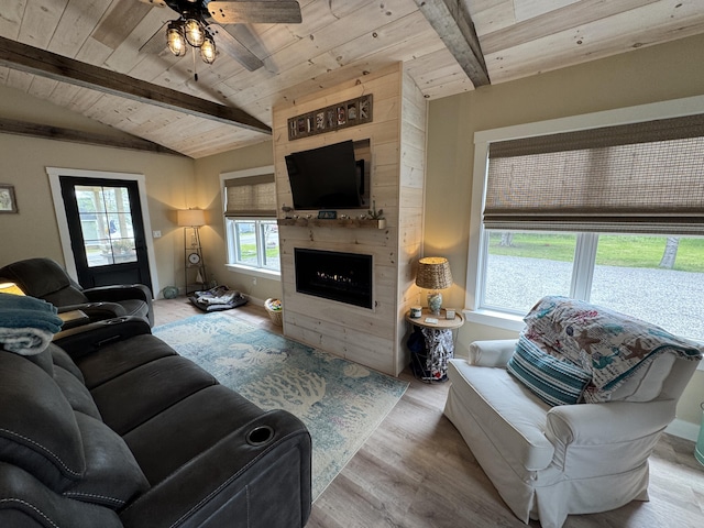 588 Mason Bay Rd, Jonesport, ME 04649 - living room featuring wood ceiling, wood finished floors, a fireplace, and ceiling fan