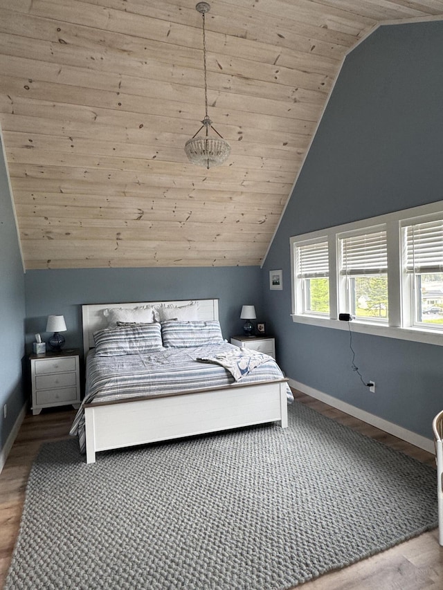 588 Mason Bay Rd, Jonesport, ME 04649 - bedroom with lofted ceiling, wooden ceiling, baseboards, and wood finished floors