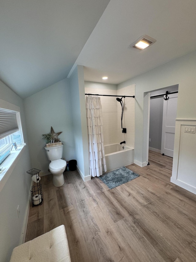 588 Mason Bay Rd, Jonesport, ME 04649 - full bathroom with toilet, wood finished floors, shower / tub combo, baseboards, and vaulted ceiling