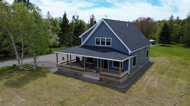 588 Mason Bay Rd, Jonesport, ME 04649 - rear view of property with a shingled roof, a lawn, driveway, and a view of trees