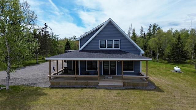 588 Mason Bay Rd, Jonesport, ME 04649 - back of house with a yard, roof with shingles, and a porch