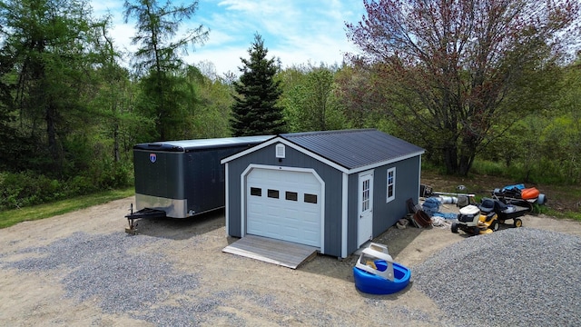 588 Mason Bay Rd, Jonesport, ME 04649 - detached garage featuring a wooded view