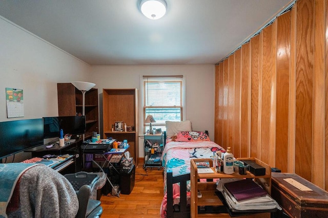 56 Intrepid St, Brunswick, ME 04011 - bedroom featuring hardwood / wood-style floors, wood walls, and an office area