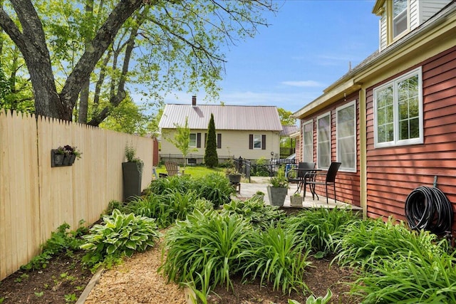44 Bridge St, Bucksport, ME 04416 - fenced backyard featuring a patio area