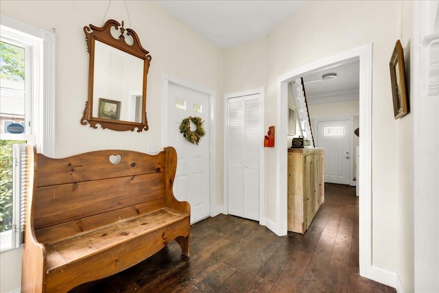 44 Bridge St, Bucksport, ME 04416 - hallway featuring dark wood-style flooring, healthy amount of natural light, and arched walkways