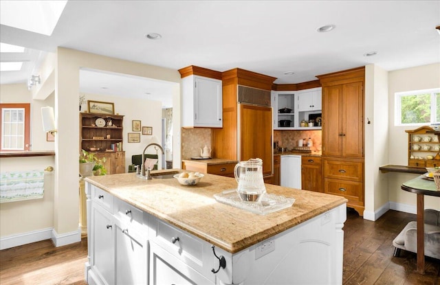 44 Bridge St, Bucksport, ME 04416 - kitchen featuring paneled fridge, open shelves, a kitchen island with sink, dark wood-style floors, and recessed lighting
