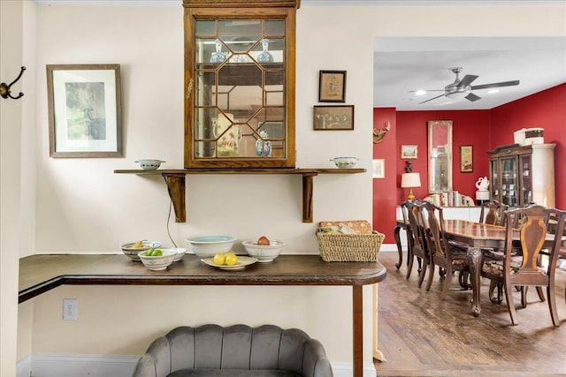 44 Bridge St, Bucksport, ME 04416 - dining room with wood finished floors, a ceiling fan, and baseboards