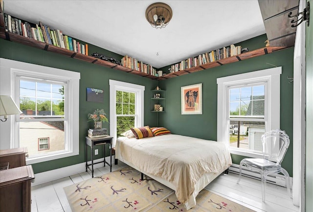 44 Bridge St, Bucksport, ME 04416 - bedroom featuring a baseboard heating unit and baseboards