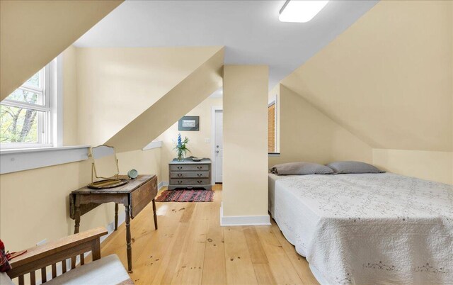 44 Bridge St, Bucksport, ME 04416 - bedroom featuring light wood finished floors, baseboards, and vaulted ceiling