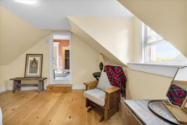 44 Bridge St, Bucksport, ME 04416 - living area with light wood finished floors, lofted ceiling, and baseboards