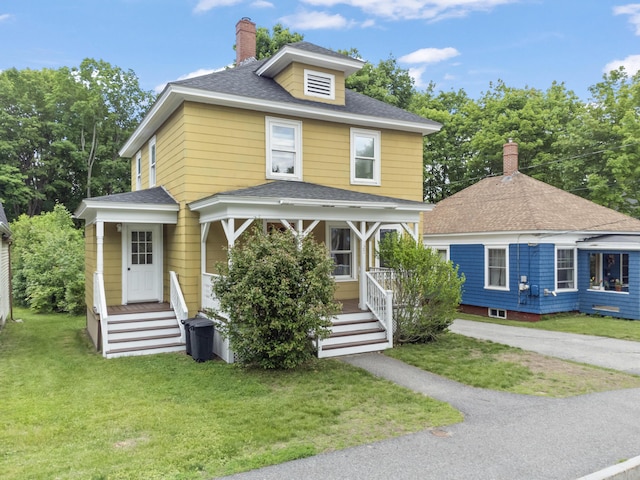 127 Lake St, Auburn, ME 04210 - traditional style home featuring a chimney, a front yard, a porch, and roof with shingles