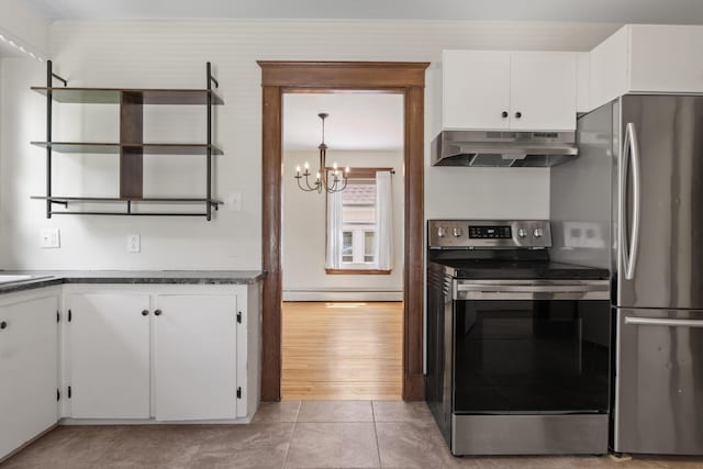 127 Lake St, Auburn, ME 04210 - kitchen featuring appliances with stainless steel finishes, under cabinet range hood, a chandelier, dark countertops, and white cabinetry