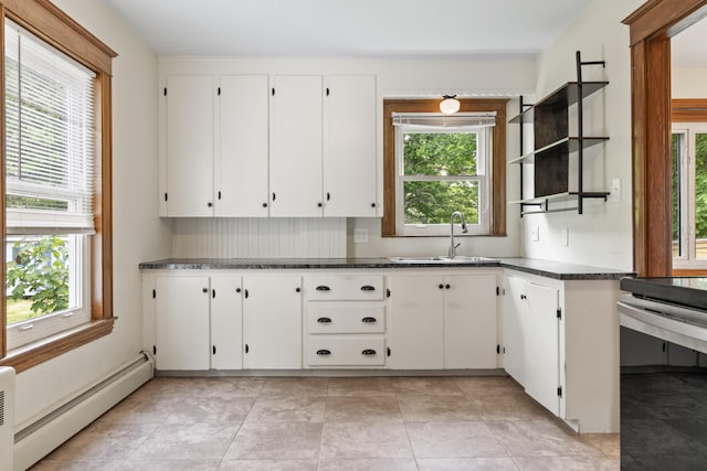 127 Lake St, Auburn, ME 04210 - kitchen with a baseboard heating unit, a sink, healthy amount of natural light, and open shelves