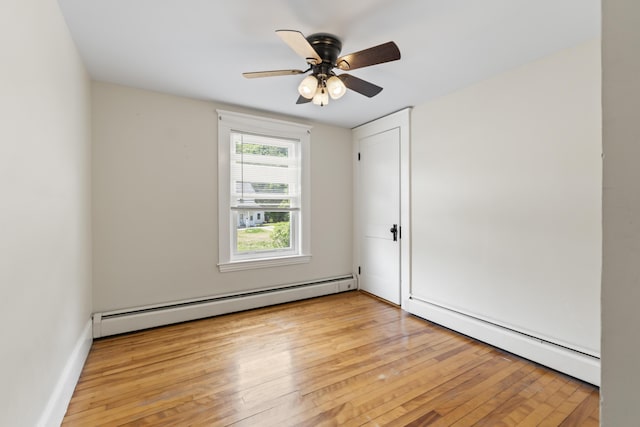 127 Lake St, Auburn, ME 04210 - empty room with baseboard heating, a baseboard heating unit, light wood-style floors, and ceiling fan
