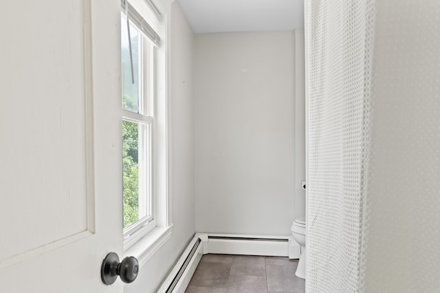 127 Lake St, Auburn, ME 04210 - hallway with tile patterned floors and baseboard heating